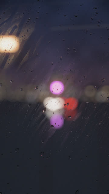 Train Window: Blue hour, the airstream pulls the drops